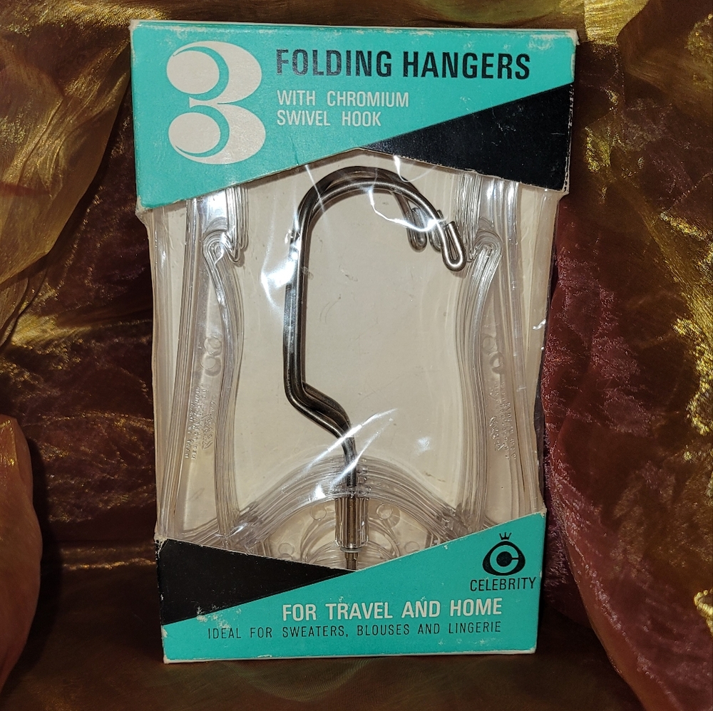 New. 3 folding hangers with chromium swivel hook.